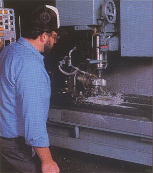 Machinist working in the Strutz machine shop